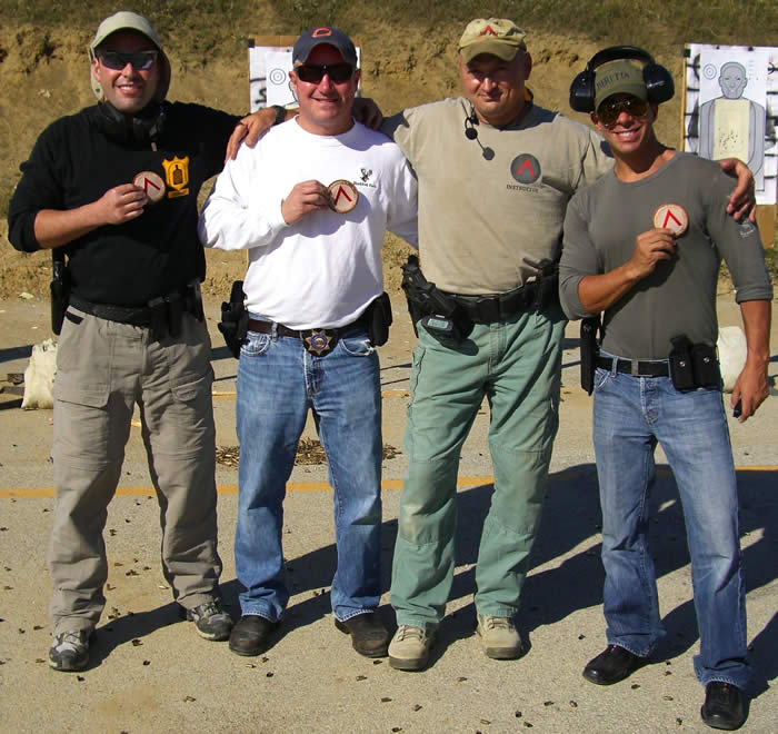 Intro to the Semi-automatic Pistol Course - Top Shooters Show Off Spartan Patches Earned in the Class